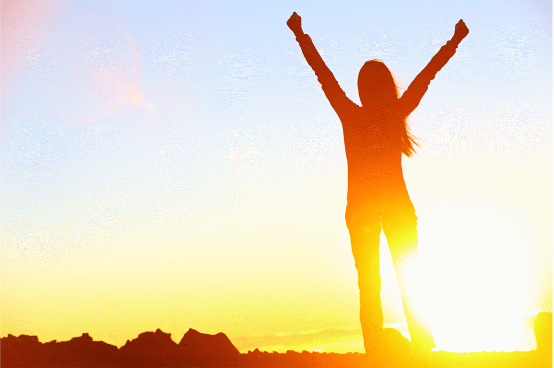 happy woman enjoying sunlight benefits